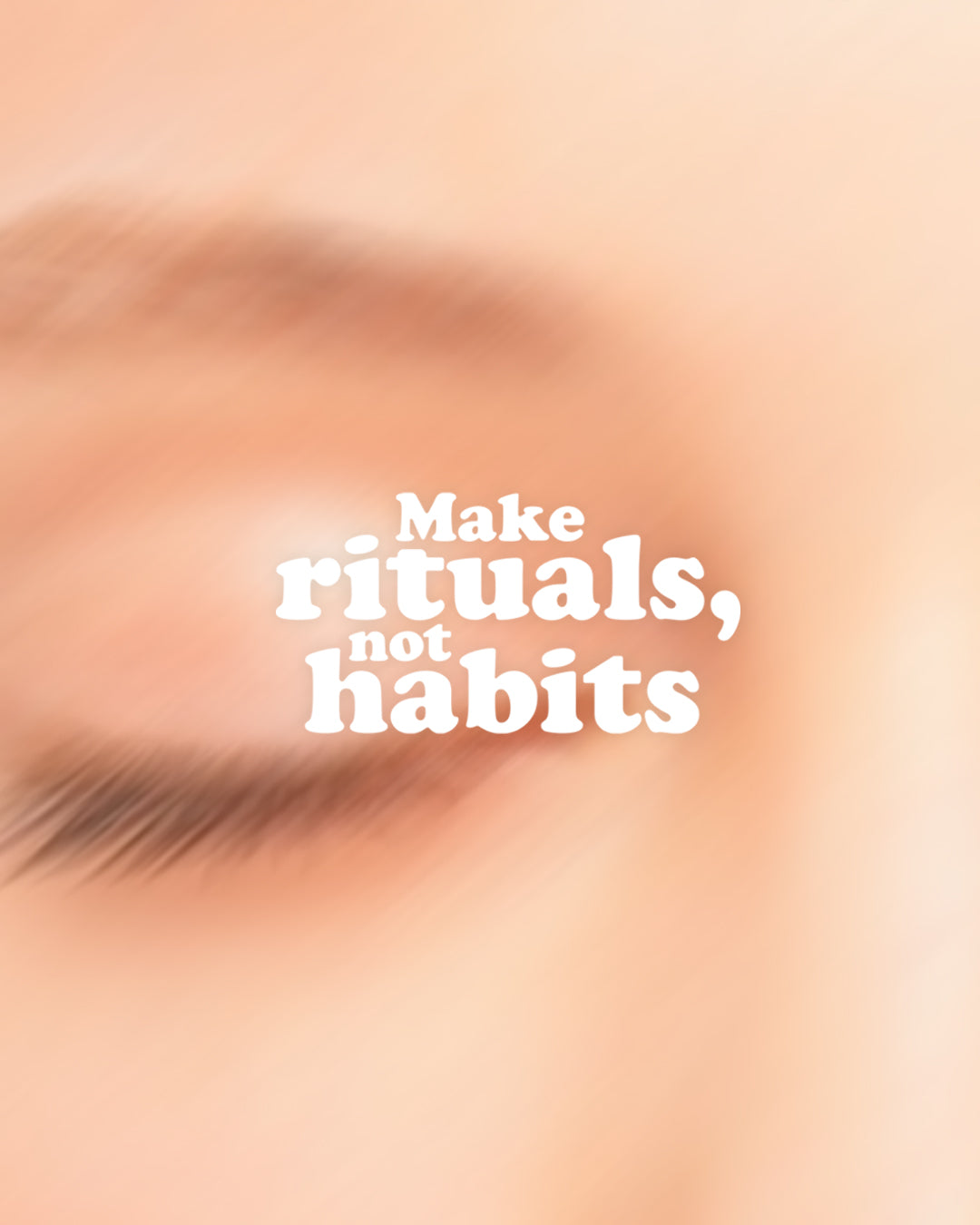 Text 'Make rituals, not habits' on a blurred background